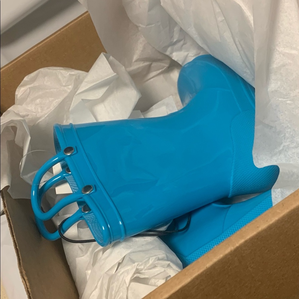 Brand new. Never worn kids galoshes!